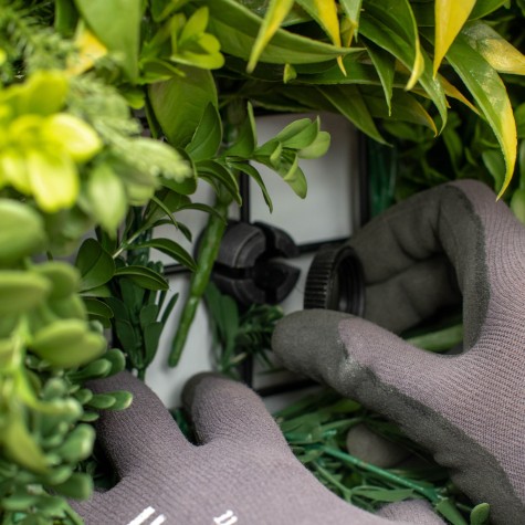 connecting the green wall panels to the wall