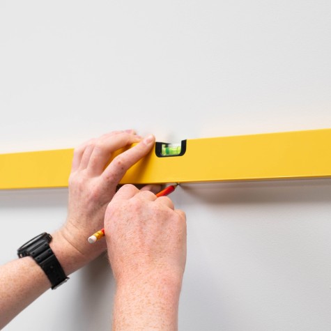 using a spirit level to make sure everything is level