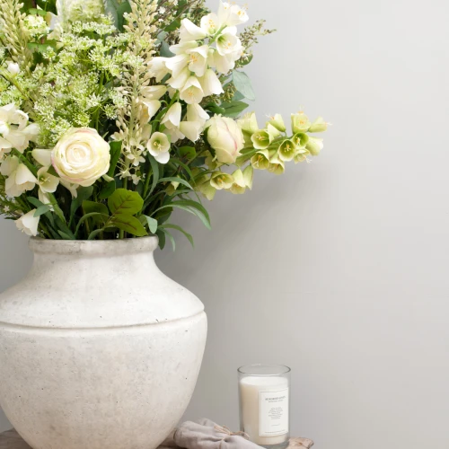 Artificial flowers on a white table