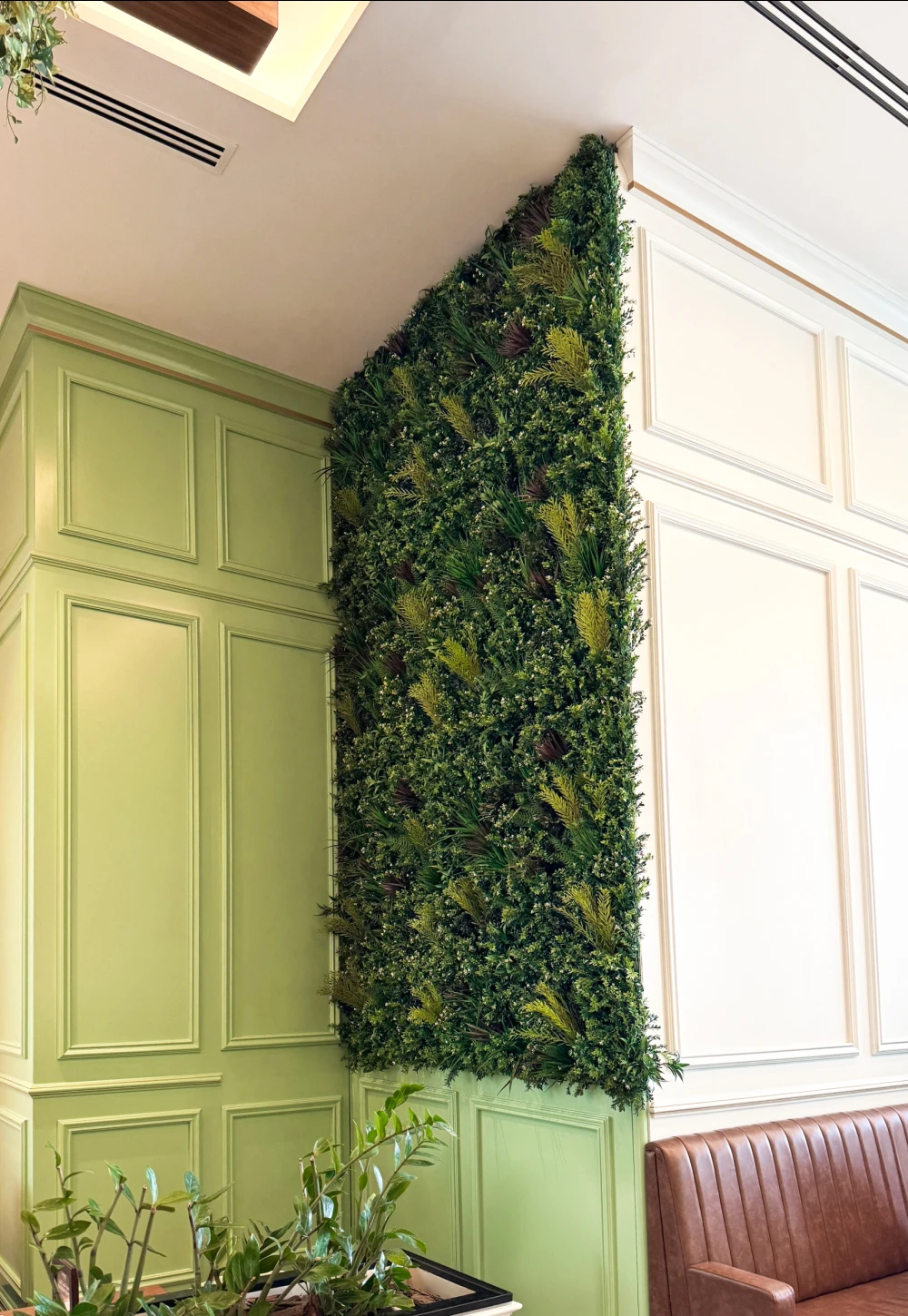 artificial green wall installed in a cafe